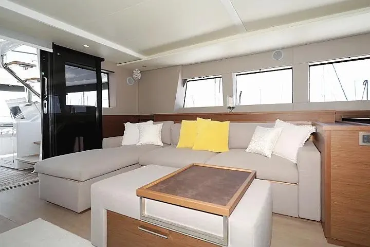 Masterdream Yacht Photos Pics Luxurious interior of 2018 Lagoon 620 Esense yacht with modern seating and decor.