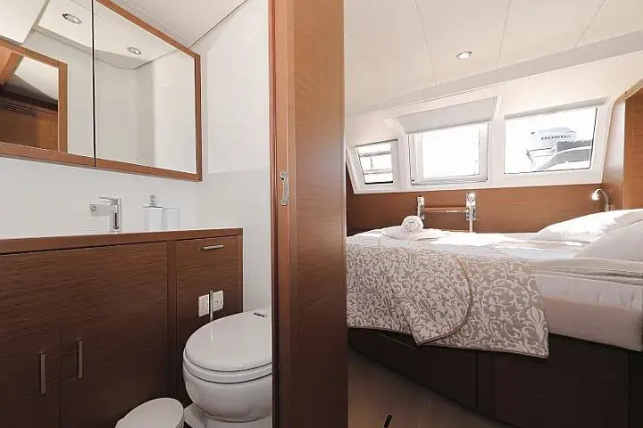 Masterdream Yacht Photos Pics Luxurious interior of 2018 Lagoon 620 Esense yacht with cozy bedroom and modern bathroom.