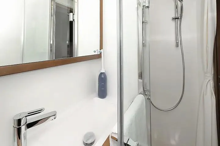 Masterdream Yacht Photos Pics Modern bathroom in 2018 Lagoon 620 Esense yacht with sleek fixtures and shower.