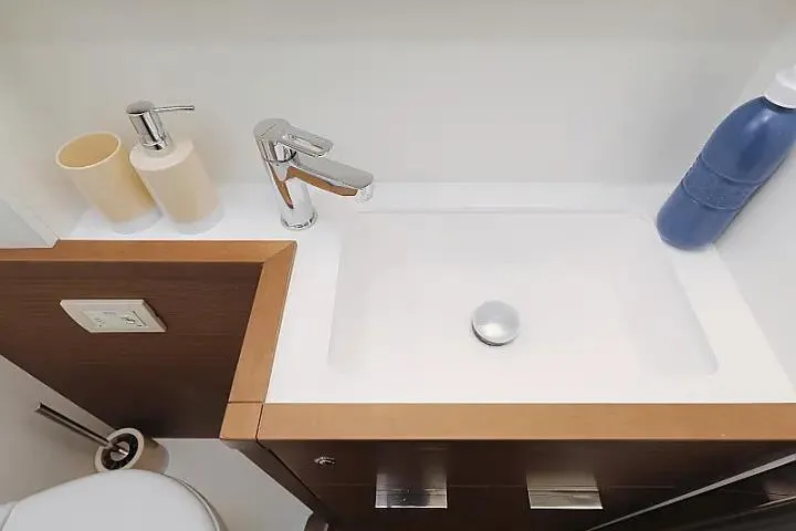 Masterdream Yacht Photos Pics Modern bathroom sink on Lagoon 620 Esense yacht, featuring sleek faucet and accessories.