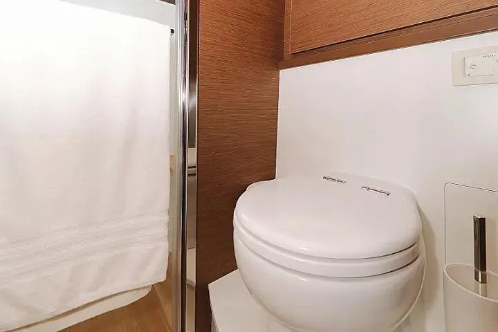 Masterdream Yacht Photos Pics Bathroom interior of 2018 Lagoon 620 Esense yacht with modern toilet and shower.