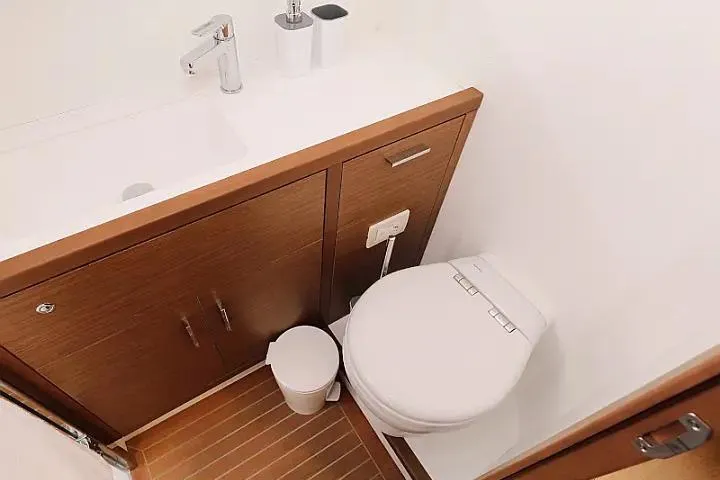 Masterdream Yacht Photos Pics Modern bathroom in 2018 Lagoon 620 Esense yacht with sleek fixtures and wood accents.