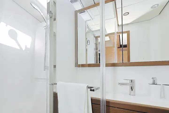 Masterdream Yacht Photos Pics Luxurious bathroom interior of 2018 Lagoon 620 Esense yacht with modern fixtures.