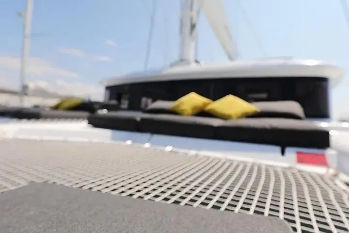 Masterdream Yacht Photos Pics 2018 Lagoon 620 Esense yacht with sunbathing area and cushions on deck.