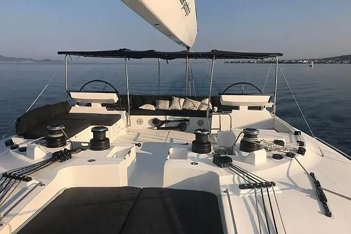 Masterdream Yacht Photos Pics 2018 Lagoon 620 Esense yacht deck with dual steering wheels and seating area.