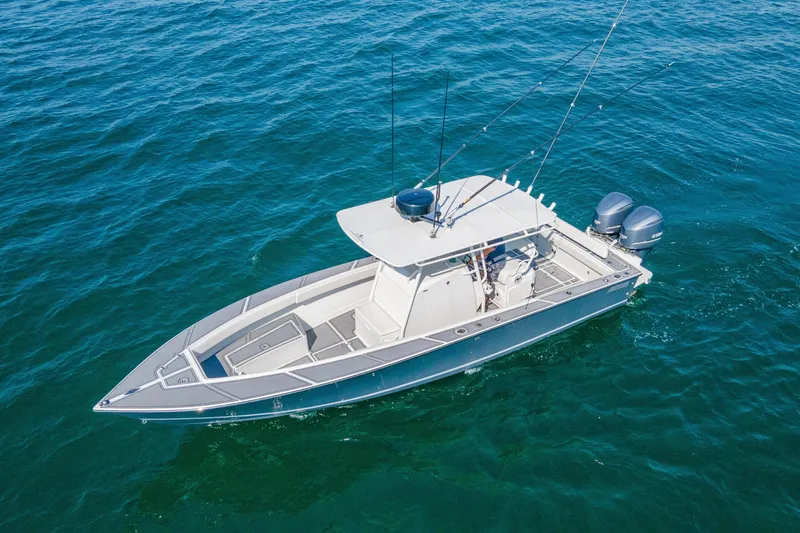 Smoke Show Yacht Photos Pics 2004 Jupiter 31 FS boat on open water, featuring dual outboard motors.