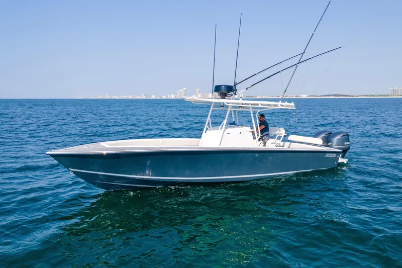 Smoke Show Yacht Photos Pics 2004 Jupiter 31 FS boat on open water with city skyline in background.