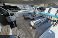 Luxurious 2023 Absolute 60 Fly yacht deck with elegant seating and dining area.