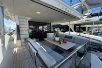 Luxurious 2023 Absolute 60 Fly yacht with elegant outdoor seating and modern design.