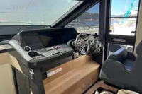 2023 Absolute 60 Fly yacht helm with modern controls and luxurious seating.