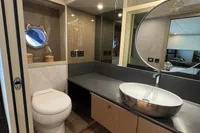 Luxurious bathroom in 2023 Absolute 60 Fly yacht with modern fixtures and elegant design.