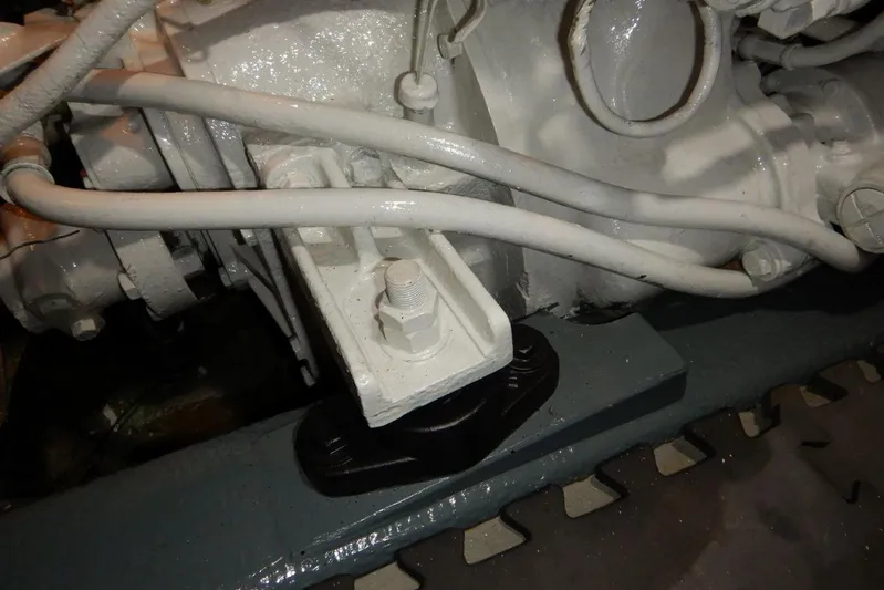  Yacht Photos Pics Engine component of 1980 Tollycraft 48 Cockpit Motor Yacht, featuring white pipes and bolts.