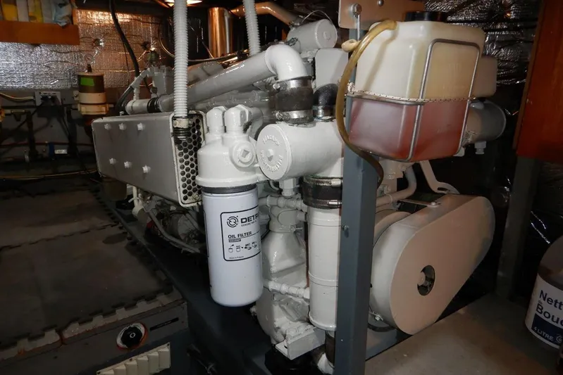  Yacht Photos Pics Engine room of 1980 Tollycraft 48 Cockpit Motor Yacht with visible oil filter.