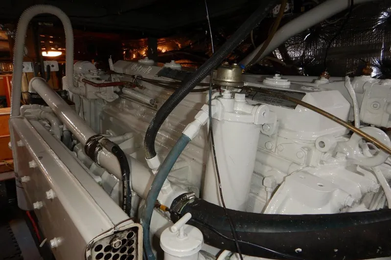  Yacht Photos Pics Engine room of 1980 Tollycraft 48 Cockpit Motor Yacht, showcasing detailed machinery.