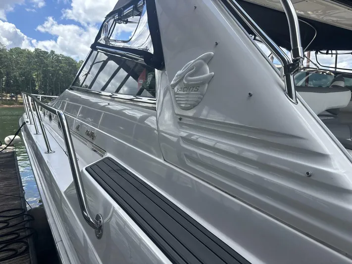 Forget About It Yacht Photos Pics 1996 Sea Ray 500 Sundancer yacht docked, showcasing sleek design and polished exterior.