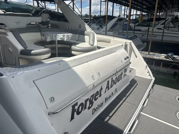 Forget About It Yacht Photos Pics 1996 Sea Ray 500 Sundancer yacht with seating area, docked in Delray Beach, FL.
