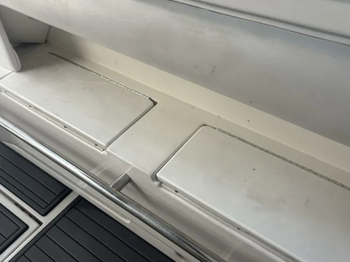 Forget About It Yacht Photos Pics Interior view of a 1996 Sea Ray 500 Sundancer boat, featuring storage compartments.