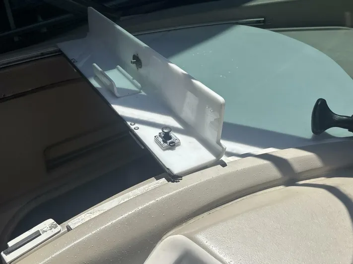 Forget About It Yacht Photos Pics 1996 Sea Ray 500 Sundancer boat detail, featuring a white hatch and latch mechanism.