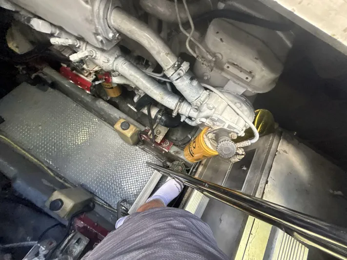 Forget About It Yacht Photos Pics Engine room of a 1996 Sea Ray 500 Sundancer with visible mechanical components.