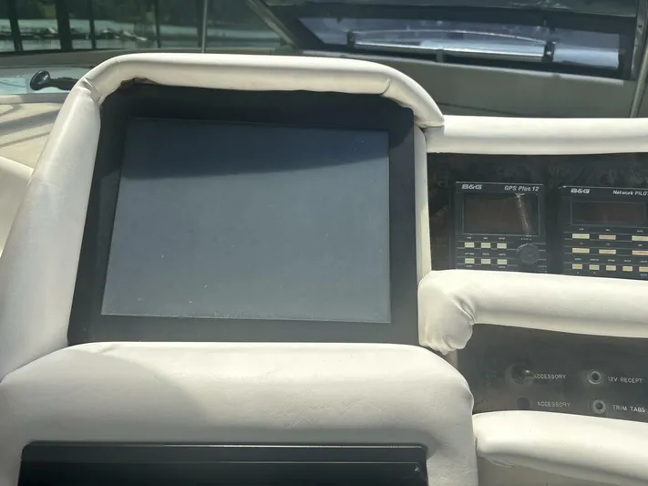 Forget About It Yacht Photos Pics Control panel of a 1996 Sea Ray 500 Sundancer yacht with navigation equipment.