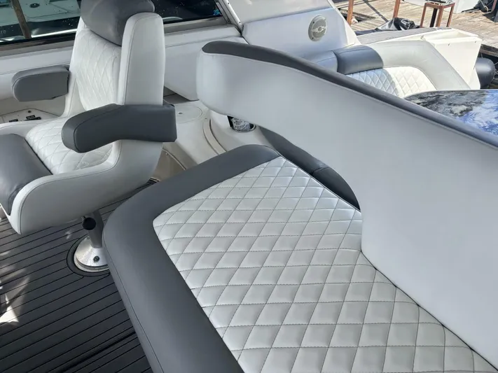 Forget About It Yacht Photos Pics Luxurious seating on a 1996 Sea Ray 500 Sundancer yacht with quilted upholstery.