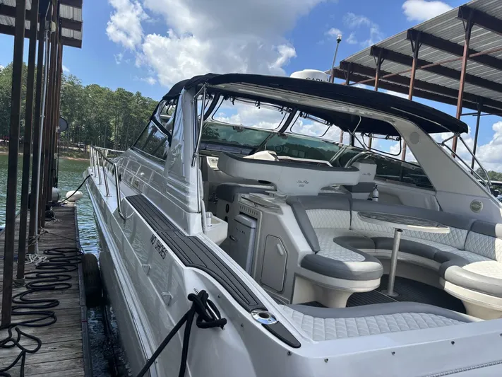 Forget About It Yacht Photos Pics 1996 Sea Ray 500 Sundancer yacht docked, featuring spacious seating and sleek design.
