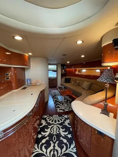  Yacht Photos Pics Luxurious interior of a 1998 Sea Ray 540 Sundancer yacht with elegant wood finishes.