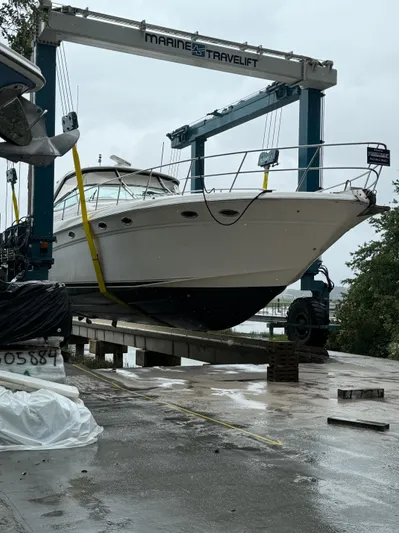  Yacht Photos Pics 1998 Sea Ray 540 Sundancer yacht on a Marine Travelift at a dock.
