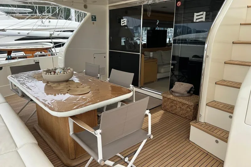  Yacht Photos Pics Luxurious 2014 Ferretti Yachts 800 deck with elegant dining area and modern seating.