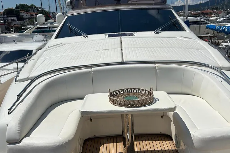  Yacht Photos Pics 2014 Ferretti Yachts 800 with white seating and table on deck, docked in marina.