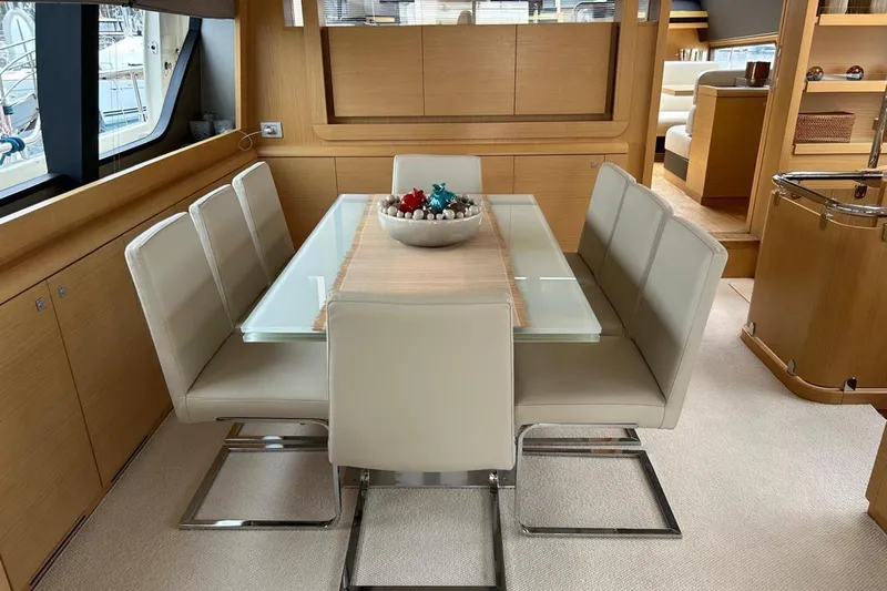  Yacht Photos Pics Dining area in 2014 Ferretti Yachts 800, featuring modern table and chairs.