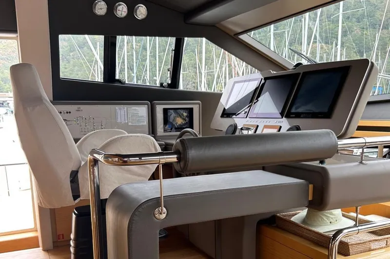  Yacht Photos Pics Control room of a 2014 Ferretti Yachts 800, featuring modern navigation equipment and luxurious seating.