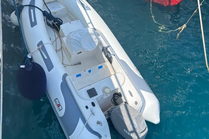  Yacht Photos Pics Inflatable boat docked on water, viewed from above, near a 2014 Ferretti Yachts 800.
