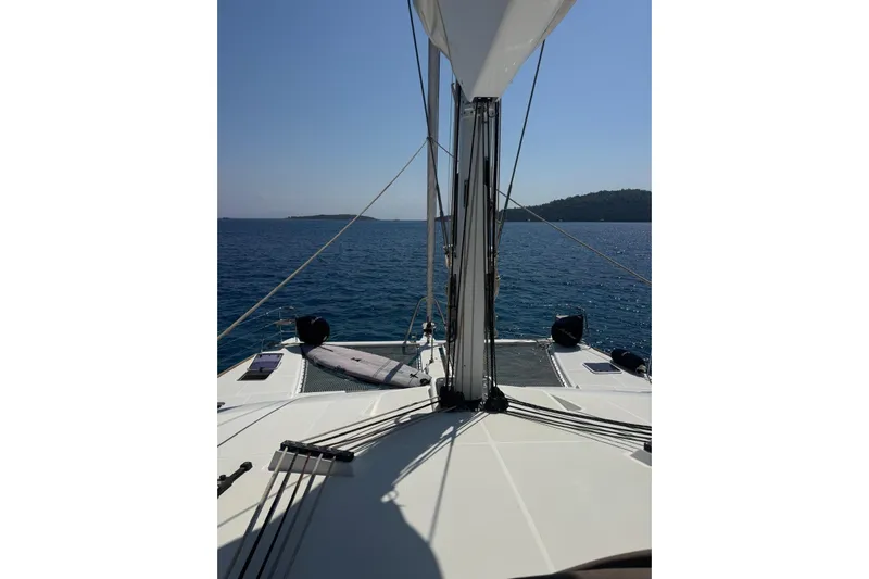  Yacht Photos Pics Lagoon 560 S2 yacht sailing on calm blue sea, 2015 model.