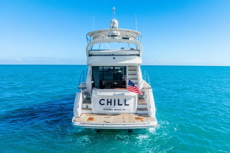 Chill Yacht Photos Pics Luxury yacht Princess F49, 2018 model, cruising in clear blue ocean waters.
