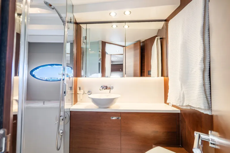 Chill Yacht Photos Pics Luxurious bathroom interior of 2018 Princess F49 yacht with modern fixtures and elegant design.