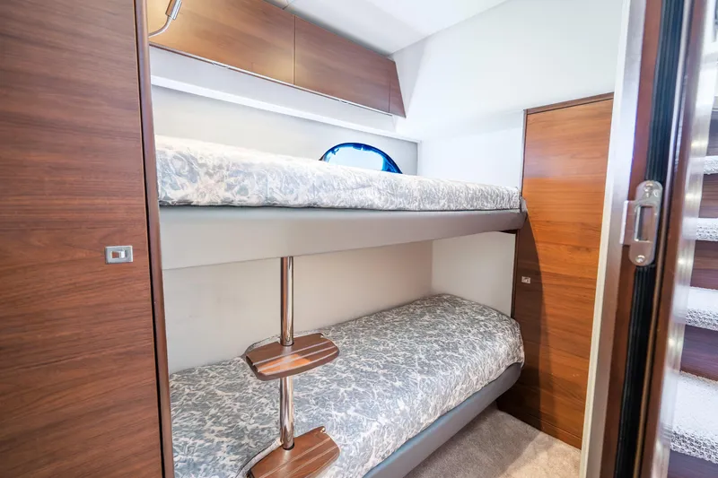 Chill Yacht Photos Pics Bunk beds in 2018 Princess F49 yacht cabin with wooden accents and modern design.