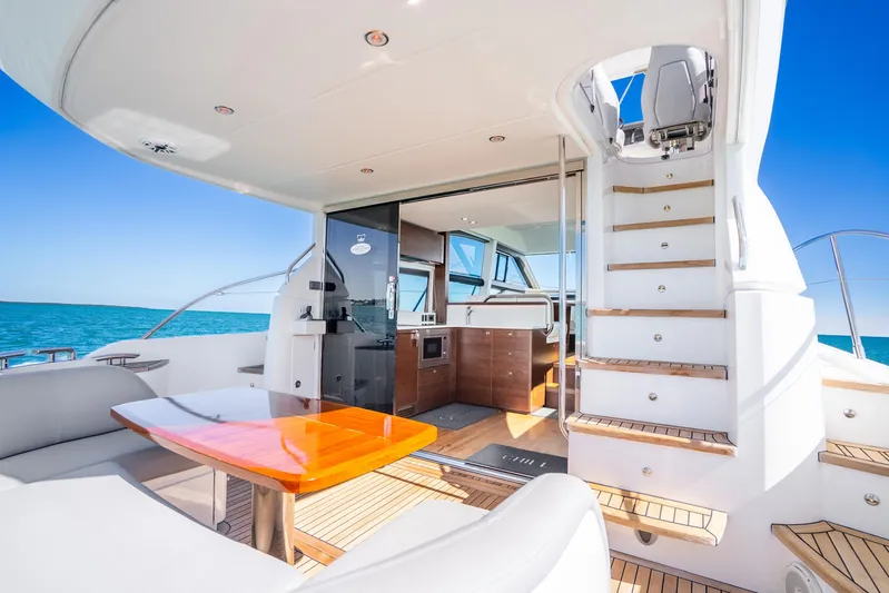 Chill Yacht Photos Pics Luxurious 2018 Princess F49 yacht interior with elegant seating and ocean view.