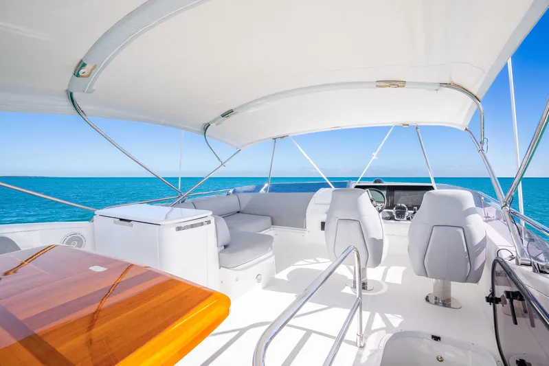 Chill Yacht Photos Pics Luxurious 2018 Princess F49 yacht interior with ocean view, featuring sleek seating and helm.