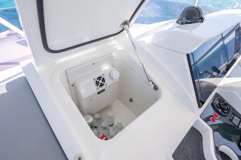 Chill Yacht Photos Pics Open storage compartment on 2018 Princess F49 yacht with drinks and ventilation fan.