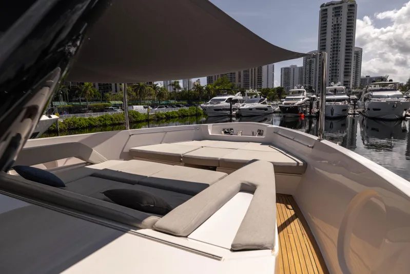  Yacht Photos Pics Luxurious 2021 Sanlorenzo SX76 yacht with spacious deck, docked in a marina.