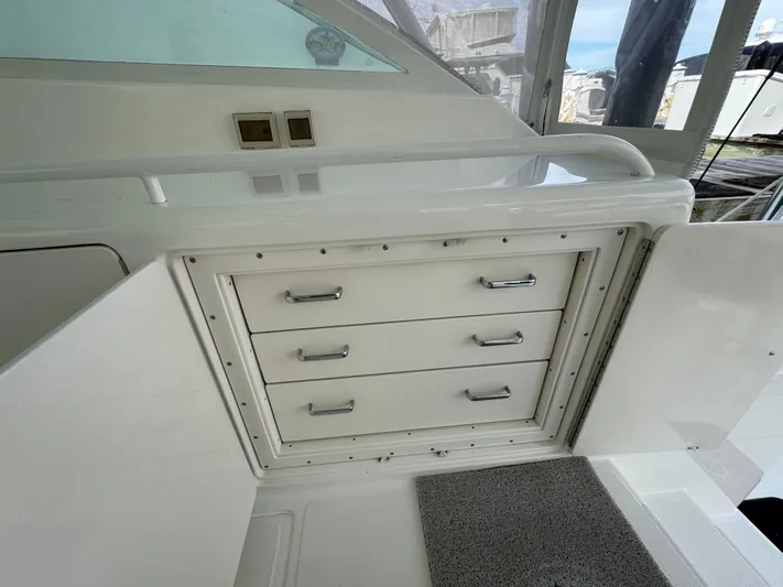  Yacht Photos Pics 1999 Cabo 45 Express boat interior with storage drawers and white cabinetry.