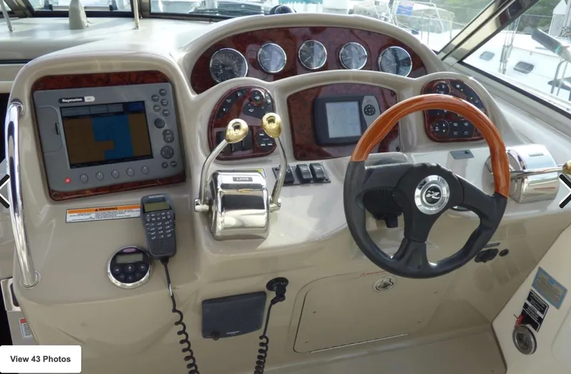  Yacht Photos Pics 2007 Sea Ray 340 helm with navigation system, gauges, and steering wheel.