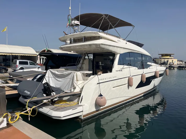  Yacht Photos Pics 2018 Prestige 520 yacht docked at marina, featuring sleek design and modern amenities.