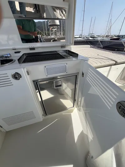  Yacht Photos Pics Outdoor kitchen on a 2018 Prestige 520 yacht with grill and storage.