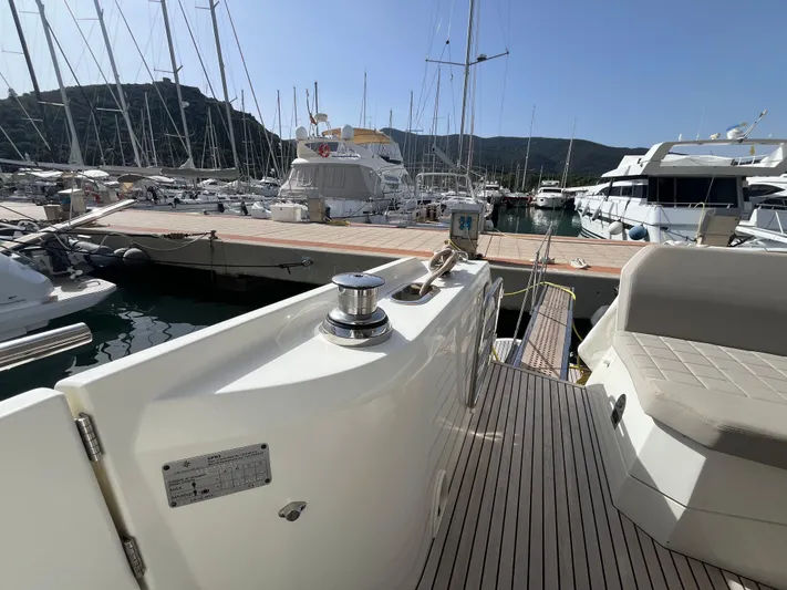  Yacht Photos Pics Luxury yacht Prestige 520, 2018 model, docked at marina with scenic mountain backdrop.
