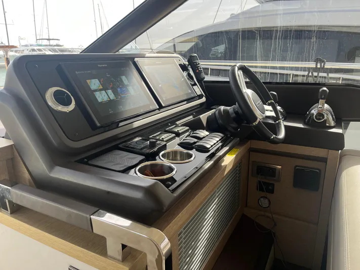  Yacht Photos Pics Helm of 2018 Prestige 520 yacht with dual screens and modern controls.