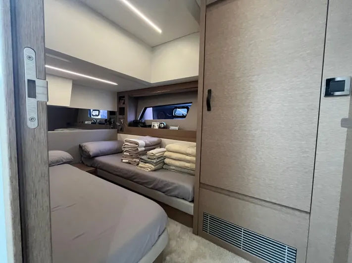  Yacht Photos Pics Luxurious cabin interior of 2018 Prestige 520 yacht with neatly arranged bedding.