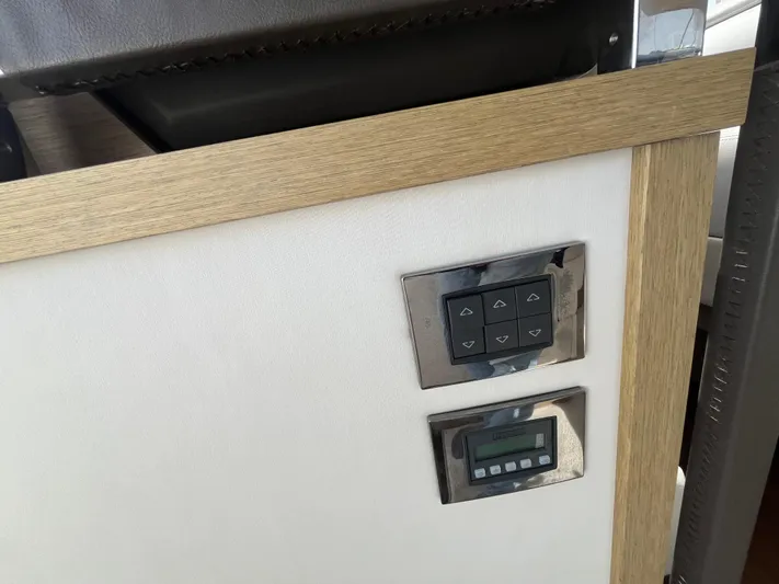  Yacht Photos Pics Control panel on a 2018 Prestige 520 yacht interior with wood trim.