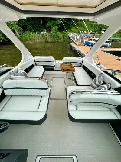  Yacht Photos Pics 2023 Regal 2800 Bowrider interior with luxurious seating and elegant design by the dock.
